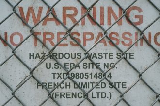 Warning signs are posted at the French Limited Superfund site. Credit: Spike Johnson