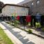 Delia and Ramon Vasquez's stiff jeans and soaking wet T-shirts hang over the wire fence surrounding their home in Cicero, Ill., July 3, 2023.