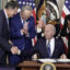 President Joe Biden shakes hands with Sen. Joe Manchin (D-WV) (L) after signing the Inflation Reduction Act on Aug. 16, 2022, with Senate Majority Leader Charles Schumer (D-NY) and House Majority Whip James Clyburn (D-SC) in the State Dining Room of the White House. Credit: Drew Angerer/Getty Images.