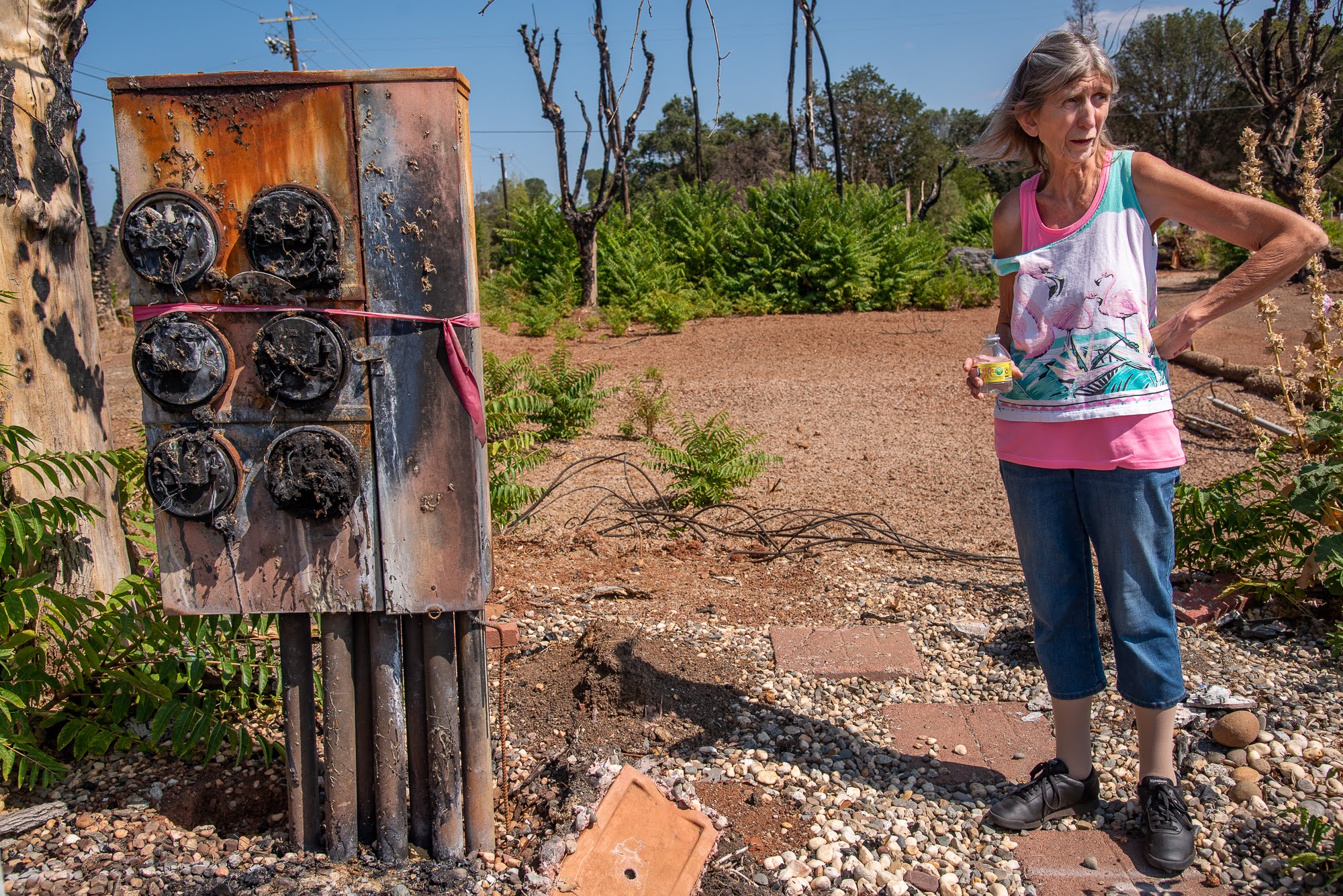 Lorraine Capolungo near the site of her mobile home in the Creekside Mobile Home Park, which burned in the Cache Fire in Clearlake, California. Credit: Michael Kodas