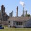 A Citgo refinery fumes behind a home in Hillcrest, Corpus Christi. Credit: Dylan Baddour/Inside Climate News