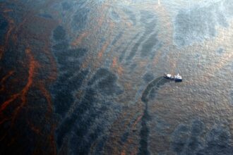 A boat works to collect oil that has leaked from the Deepwater Horizon wellhead in the Gulf of Mexico on April 28, 2010 near New Orleans, Louisiana. Credit: Chris Graythen/Getty Images