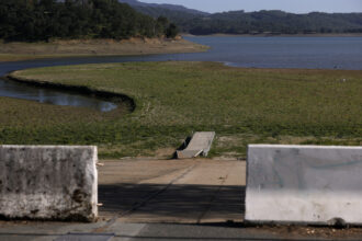A boat dock sits on dry ground far from the water at Lake Mendocino on April 22, 2021 in Ukiah, California. Credit: Justin Sullivan/Getty Images