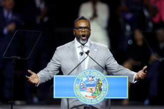 Chicago Mayor Brandon Johnson speaks to guests after taking the oath of office on May 15, 2023 in Chicago, Illinois. Johnson, a former school teacher and union organizer, replaces outgoing Mayor Lori Lightfoot. Credit: Scott Olson/Getty Images