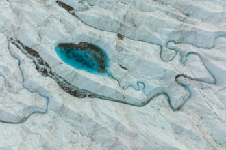 An aerial view of meltwater lakes formed at the Russell Glacier front, part of the Greenland ice sheet in Kangerlussuaq, Greenland, on Aug. 16, 2022. Credit: Lukasz Larsson Warzecha/Getty Images