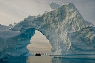In Earth's geological past, surges of icebergs in the Arctic have been linked with sudden and almost simultaneous warming in Antarctica. Scientists say climate connections between the poles have important implications for the modern era of global warming, and that there may be unexpected impacts. Credit: Bob Berwyn
