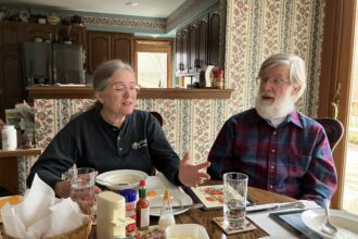 Sharon and Michael Wildermuth eat lunch at their house near Lima, Ohio, on Nov. 17, 2022. Michael is the founder and leader of an organization supporting a solar power project in the community. Credit: Dan Gearino