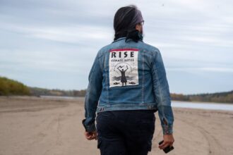 Jean L'Hommecourt visits a river near the Fort McKay First Nation's village about an hour's drive north of Fort McMurray in Alberta, Canada. Credit: Michael Kodas/Inside Climate News