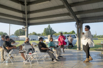 In Darrow, Louisiana, Monique Harden of the Deep South Center for Environmental Justice talks to residents about carbon capture at the Hillaryville Pavilion in June. Credit: Emily Kask for the Washington Post via Getty Images.