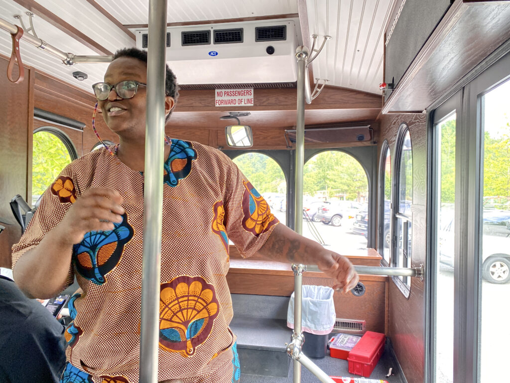 Zeevelle Nottingham-Lemon, the head of Cherry Hill Strong, gestures during the bus tour of Cherry Hill, which she had organized. The neighborhood tour was intended to showcase community projects such as blight reduction, affordable housing, educational programs and sports implemented by local community groups such as hers. Credit: Aman Azhar / Inside Climate News.