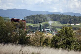 A natural gas compressor station on a hillside in Penn Township, Pennsylvania. Credit: Robert Nickelsberg/Getty Images.