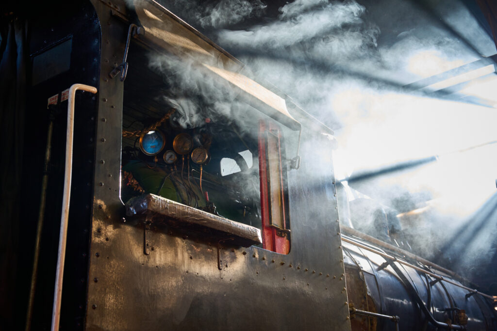 The Nevada Northern Railway engine No. 93 begins to produce steam, sunlight passes through windows in the roof in Ely, Nevada, on Thursday Oct. 5, 2023. Credit: Alex Gould