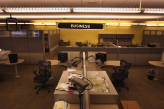 In Denver, the newsroom of the Rocky Mountain News sits empty in February 2009 after publication of the newspaper's last edition. The owner E.W. Scripps Co. announced that the "Rocky" was closing down after efforts to sell the money-losing newspaper failed. Credit: John Moore/Getty Images.