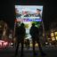 A large screen outside a shopping mall in Beijing shows news coverage of the arrival of Chinese President Xi Jinping at San Francisco International Airport on Wednesday, after China and the United States released a joint statement of cliimate cooperation. Credit: Pedro Pardo/AFP via Getty Images